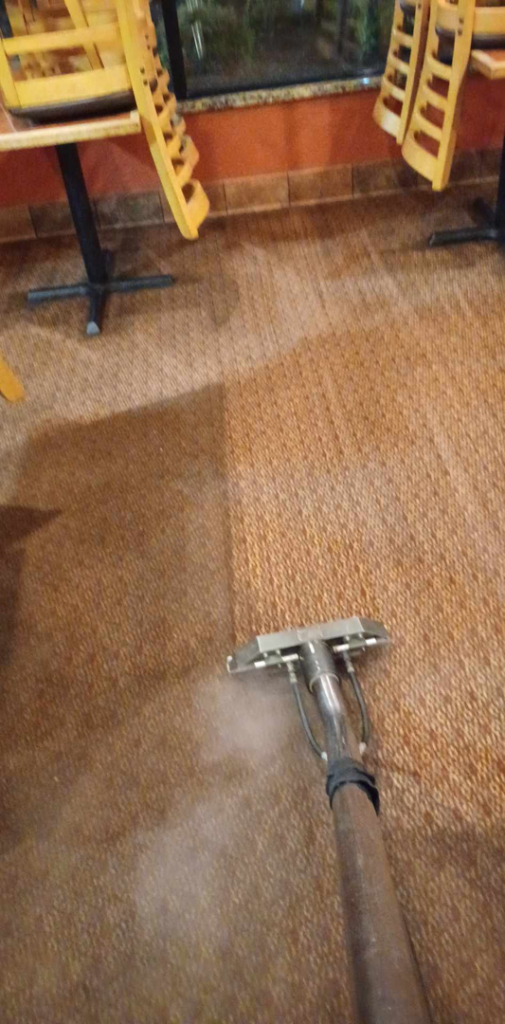 Commercial carpet cleaning in progress at a business by Professional Carpet Systems of Raleigh, NC