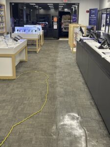 A commercial carpet showing a clear distinction between cleaned and uncleaned areas, demonstrating work by Super Duper Carpet & Duct Cleaning in Pittsburgh, PA.