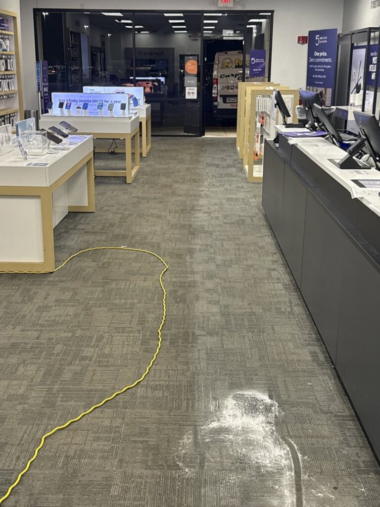 A commercial carpet showing a clear distinction between cleaned and uncleaned areas, demonstrating work by Super Duper Carpet & Duct Cleaning in Pittsburgh, PA.