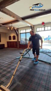 A Pro Team Carpet Cleaning Sacramento, CA technician performing commercial carpet cleaning in a large facility.