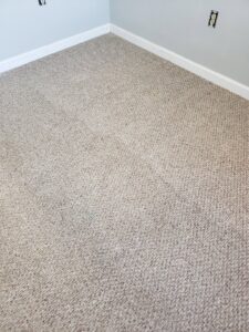 Commercial carpet cleaning process in a restaurant with a cleaning wand and hose, by Keith's Cleaning Service in Auburn, ME