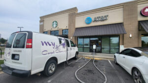 A My Carpet Cleaner Nashville, TN van with hoses set up for a commercial carpet cleaning job