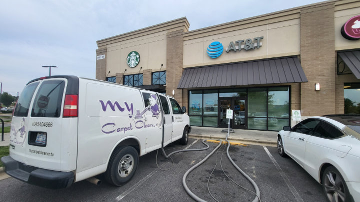 A My Carpet Cleaner Nashville, TN van with hoses set up for a commercial carpet cleaning job