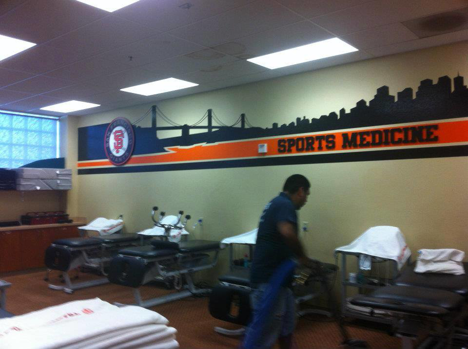 Technician performing commercial carpet cleaning in a sports medicine facility by Apex Carpet Cleaning & Flood Restoration LLC, Phoenix, AZ