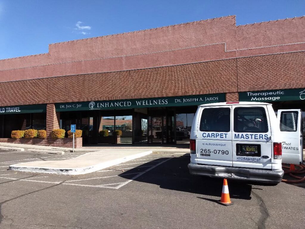 A Carpet Masters of Albuquerque van with hoses extended, indicating commercial carpet cleaning in Albuquerque, NM.