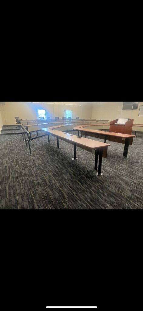 New dark patterned commercial carpet installed in a large conference room by Reserved Installations LLC in Orlando, FL