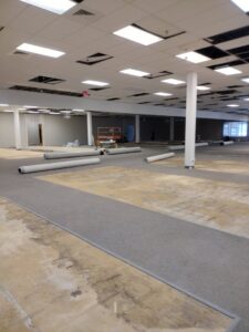 Commercial carpet installation in progress at a large facility by New City Carpet And Flooring in Chicago, IL