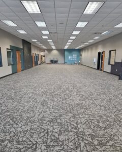 Newly installed commercial carpet in a large office space by Rayman Flooring in Aberdeen, SD