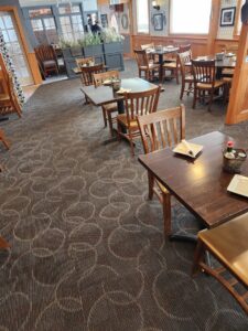 Newly installed patterned commercial carpet in a restaurant by Carpet Center in Wilmington, NC.