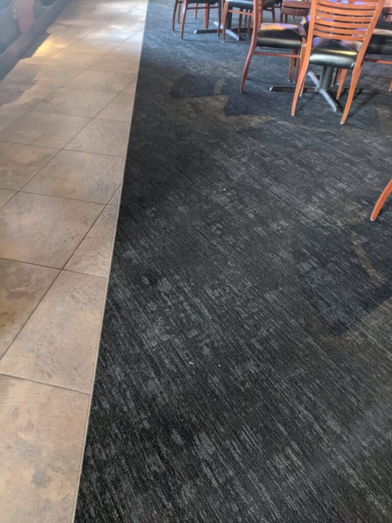 Durable carpet tiles installed in a commercial dining area by Great Spaces Floor Co in Minneapolis, MN.