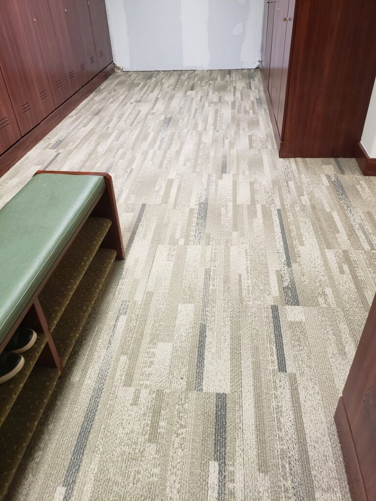 Newly installed commercial carpet tile flooring in a changing room by Chicago Floor Systems in Chicago, IL