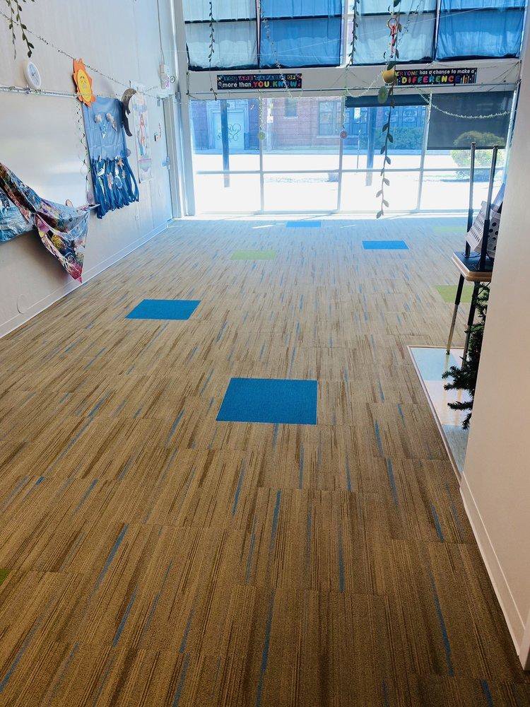 A room with newly installed commercial carpet tile flooring by Anderson Certified, INC. in Chicago, IL.