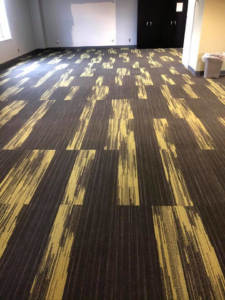 A large commercial room with newly installed patterned carpet tiles by Conaway Flooring LLC in Wheeling, WV.