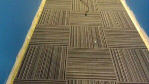 Commercial carpet tiles with a striped pattern expertly installed by Delgado Carpet Services in San Jose, CA