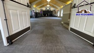 Newly installed commercial carpet tiles in a large open space by DLS Flooring in Akron, OH.