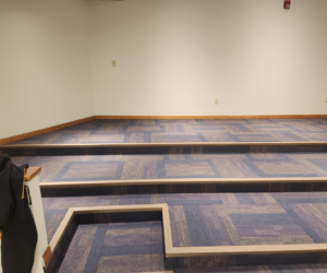 A large room with newly installed commercial carpet tiles, completed by Flooring of Springfield in Springfield, IL.