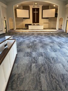 Commercial carpet tile installation completed in a large hall by Harry's Carpet One in Quincy, MA.