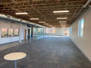 A large commercial space with newly installed grey carpet tiles by Innovative Installations LLC in Rapid City, SD.