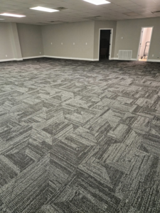 Newly installed commercial carpet tiles in a large office space by JB'S floor covering in Semmes, AL