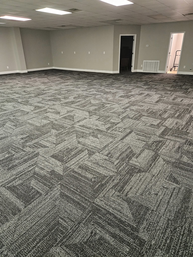 Newly installed commercial carpet tiles in a large office space by JB'S floor covering in Semmes, AL