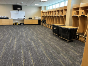 Commercial carpet tile installation in a spacious locker room by Branch Floor Covering in Cranston, RI