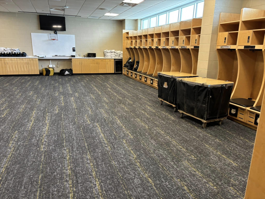 Commercial carpet tile installation in a spacious locker room by Branch Floor Covering in Cranston, RI