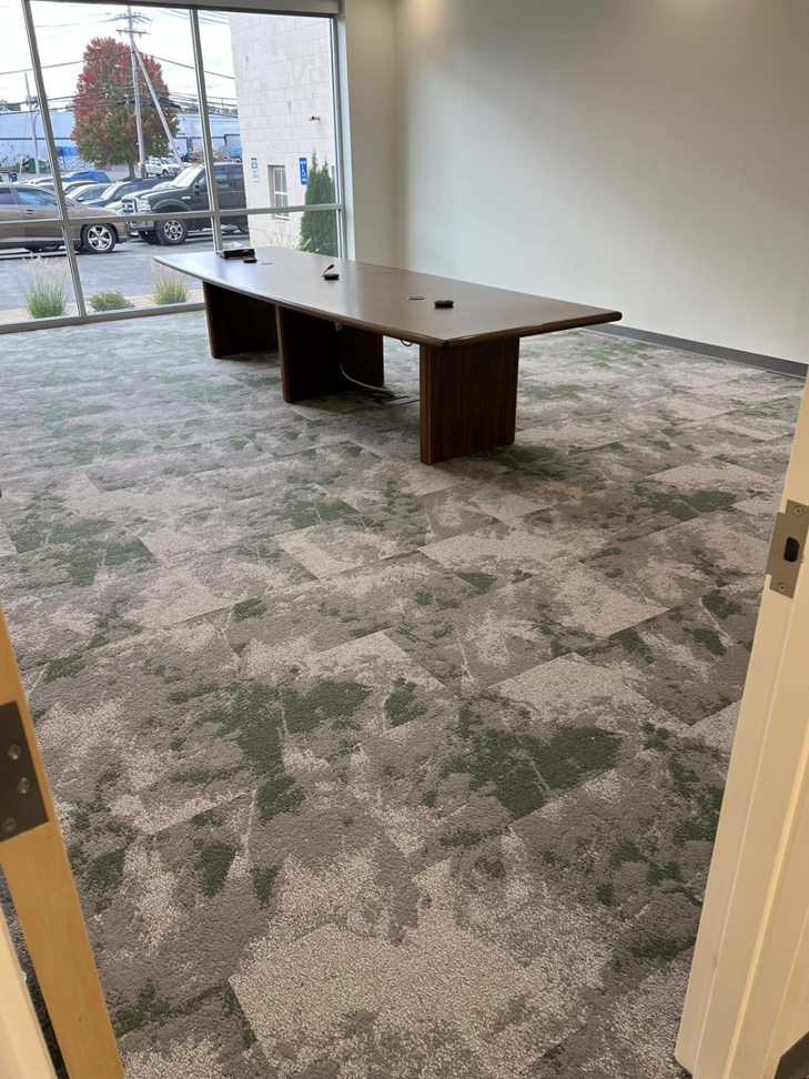 Commercial carpet tile installation in an office conference room by Messina's Flooring & Carpet Property Division in Salem, NH