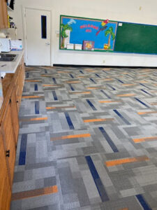 A newly installed commercial carpet tile floor with a modern pattern by Midwest Coast Flooring in North Bend, OR