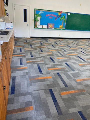 A newly installed commercial carpet tile floor with a modern pattern by Midwest Coast Flooring in North Bend, OR