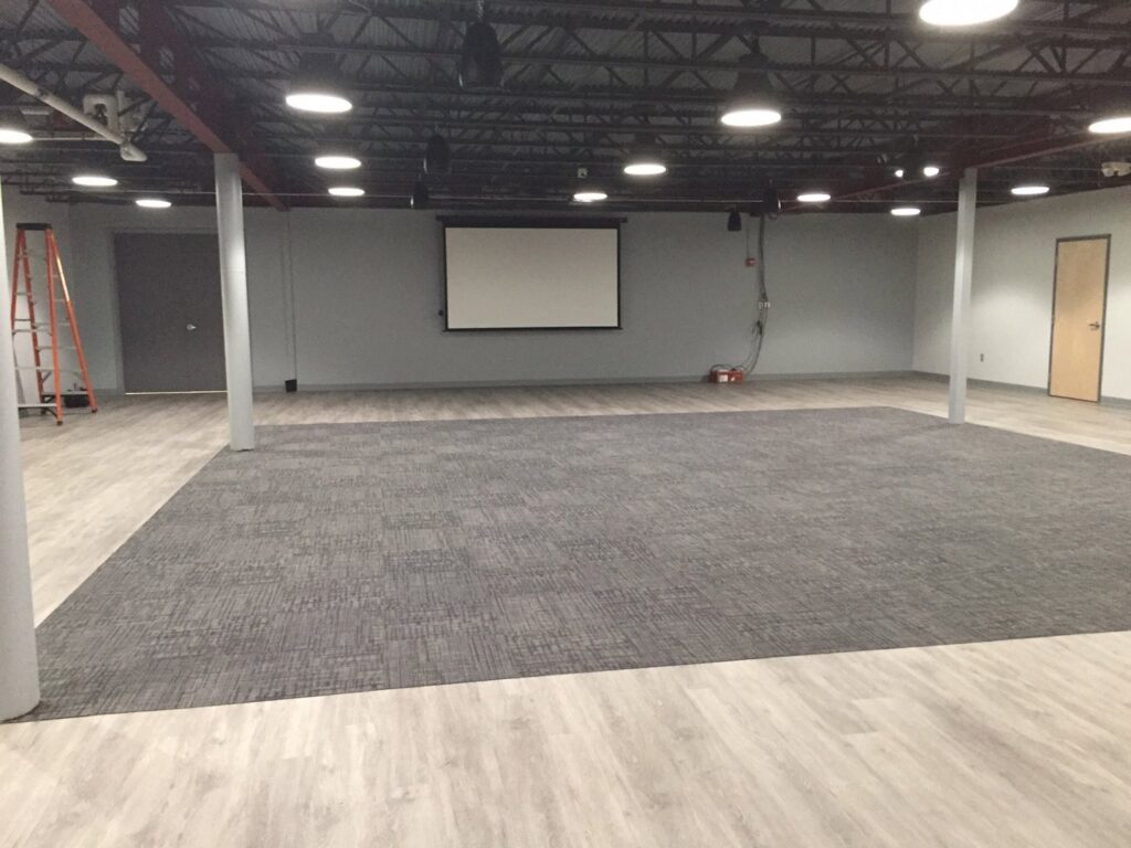 Commercial space with new grey carpet tile installation by Seacoast Flooring in Saco, ME.