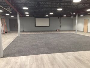 Commercial space with new grey carpet tile installation by Seacoast Flooring in Saco, ME.