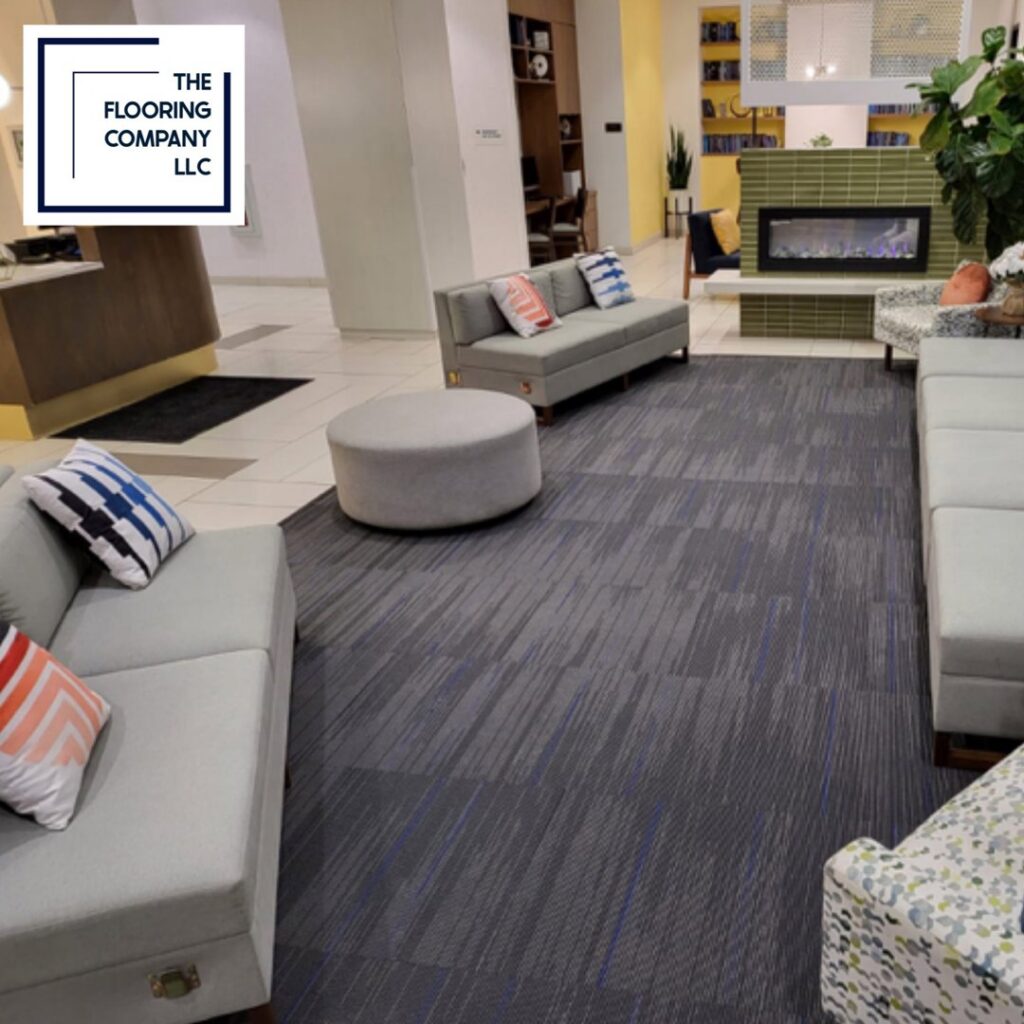 A commercial lobby featuring a modern patterned carpet tile installation by The Flooring Supplies Co. in Livonia, MI.