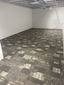 Commercial carpet tile installation in a room by Mendez Carpet in Grand Rapids, MI.
