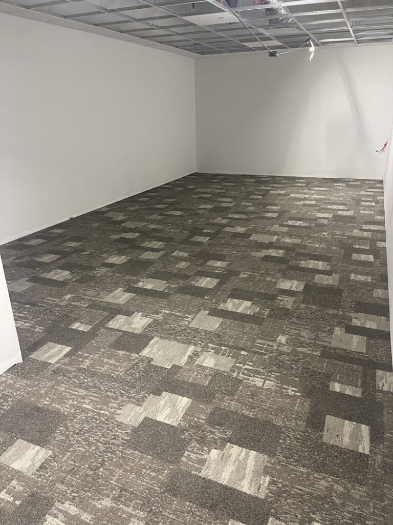 Commercial carpet tile installation in a room by Mendez Carpet in Grand Rapids, MI.
