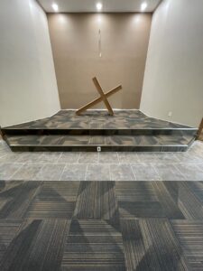 Commercial carpet tile and wood-look tile platform installed by Mendez Carpet in Grand Rapids, MI.