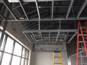 Commercial ceiling with exposed electrical wiring and junction boxes installed by Allied Electric Company of Minnesota in Minneapolis, MN