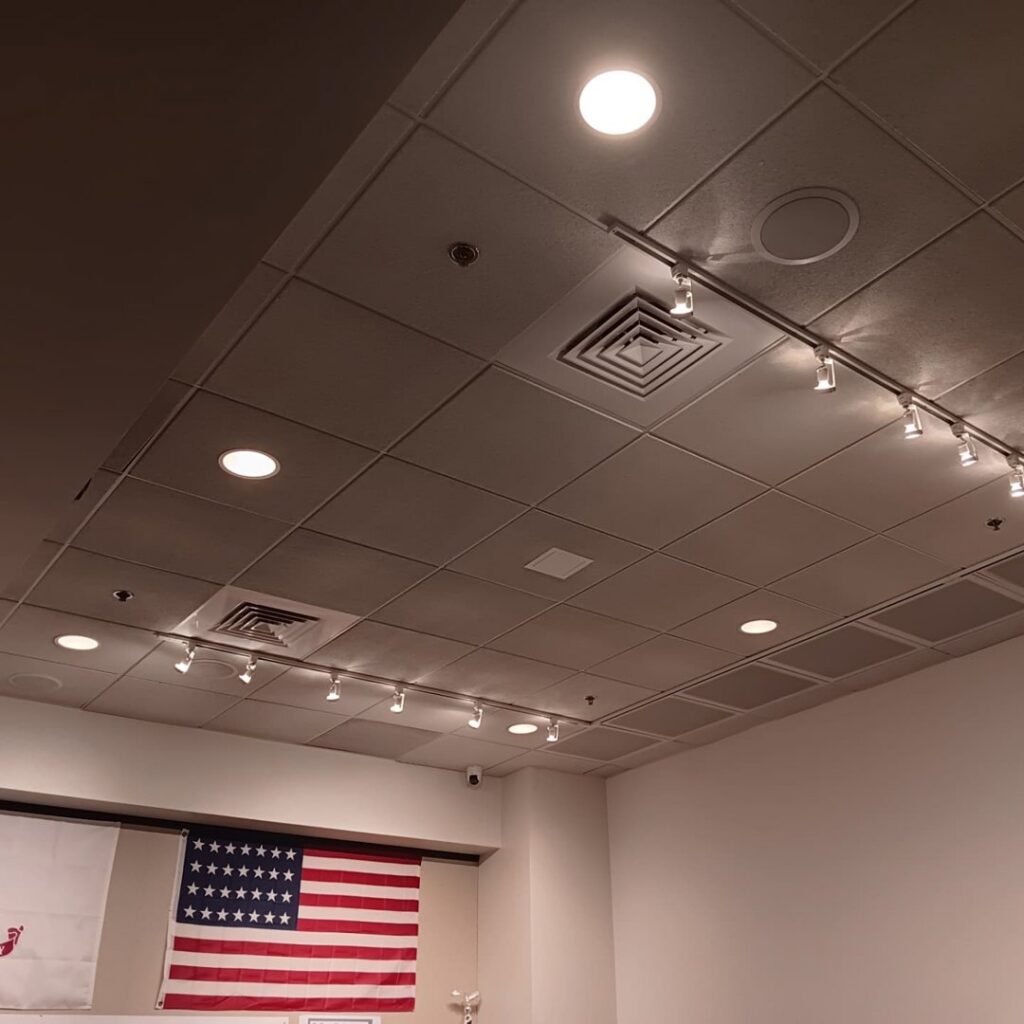 A commercial ceiling with newly installed recessed and track lighting by Ride the Lightning Electrical Services in El Cajon, CA.