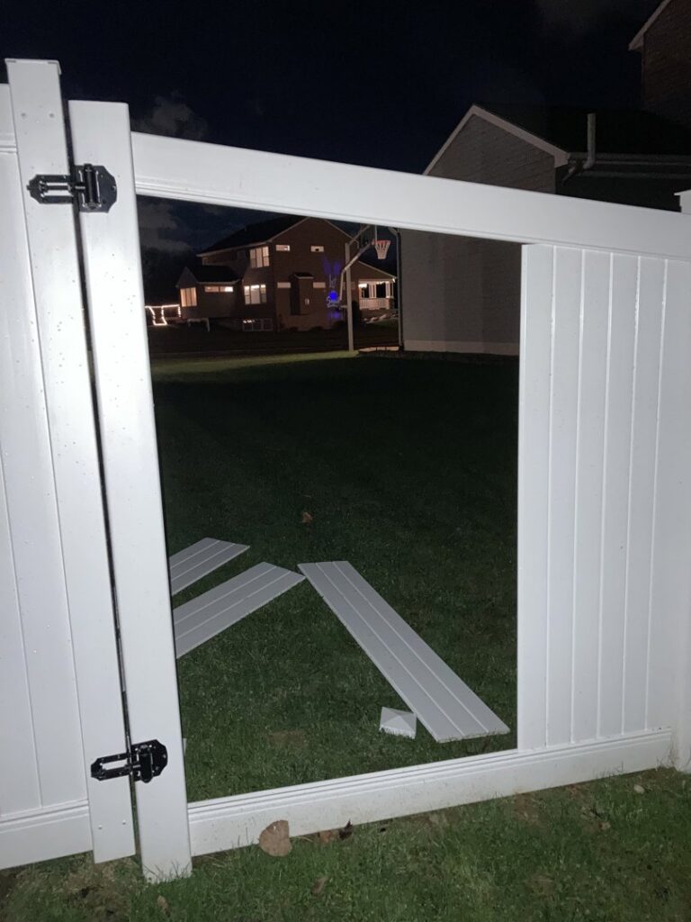 Commercial chain-link fence with a large gate installed by Pro-Soil Site Services, Inc in Lansing, MI