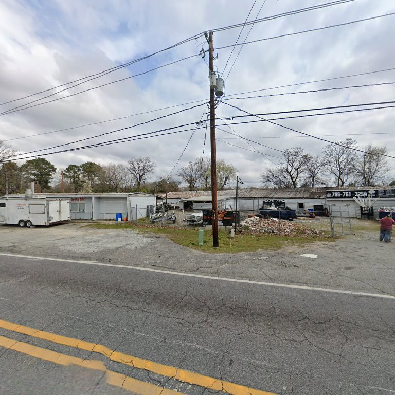 A commercial property secured with a chain-link fence, demonstrating fencing services by G2 Home Solutions in Phenix City, AL.