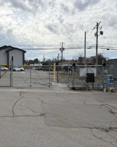 A commercial chain-link fence gate with an automatic opener installed by Gilliam Services LLC in Johnson City, TN.
