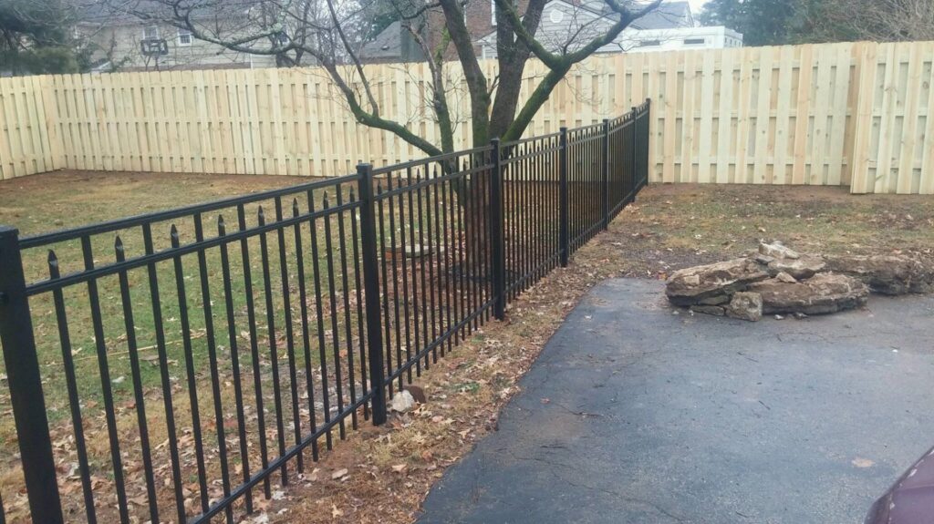 A commercial chain-link fence with a large sliding gate installed for property access by Best Fence & Gate LLC in Louisville, KY.
