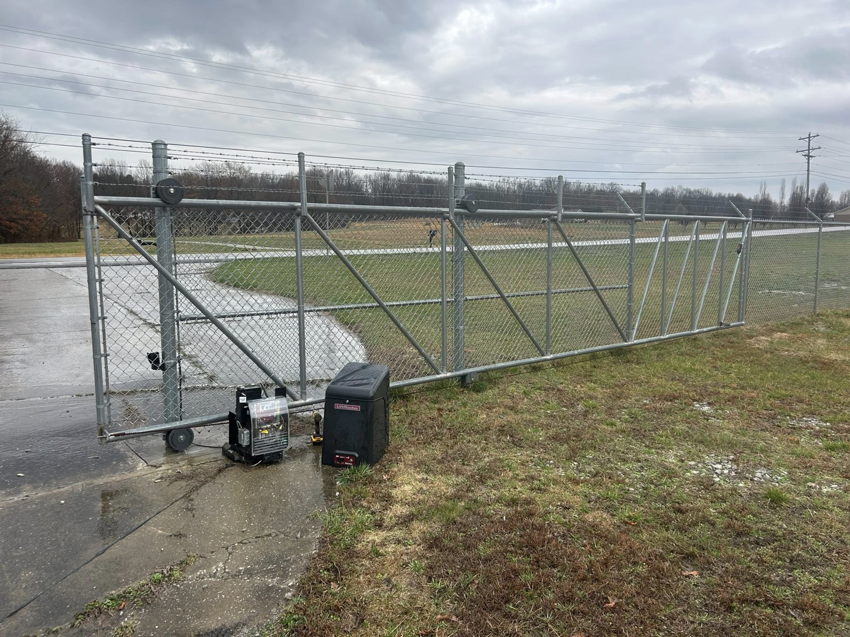 Commercial chain link sliding gate with automatic opener installed by Rager Fencing & Lawn Care, LLC in Owensboro, KY.