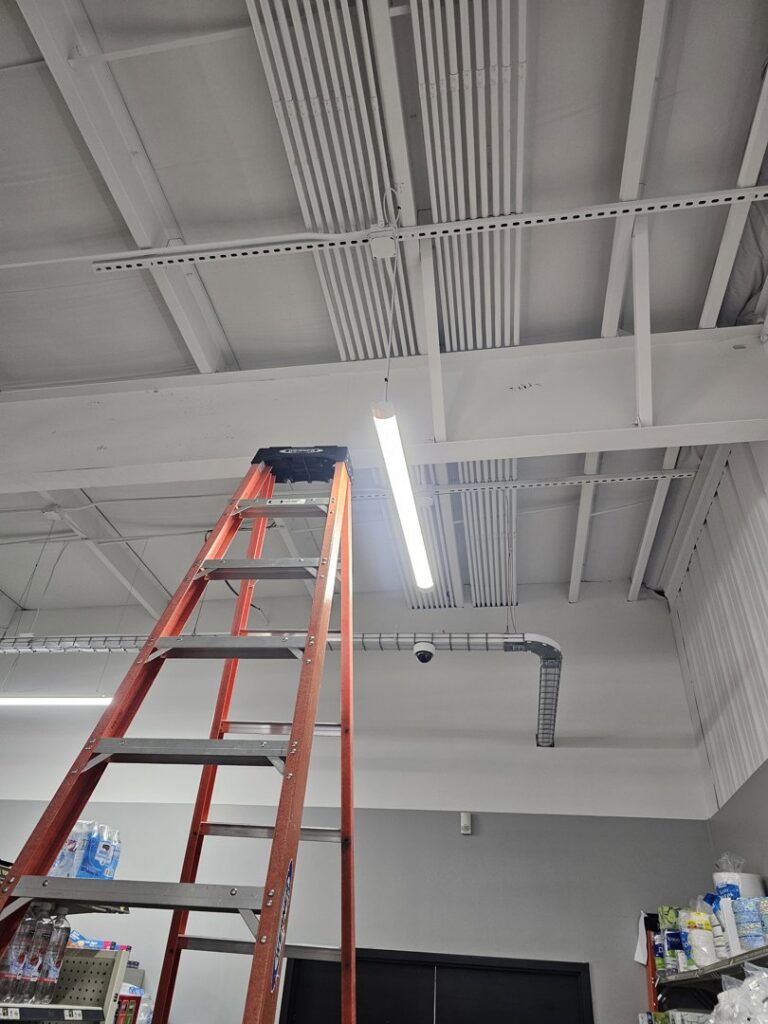 Commercial electrical conduit and fluorescent lighting installation in a retail space by Powered Electrical & Lighting Services LLC in Springfield, MO.