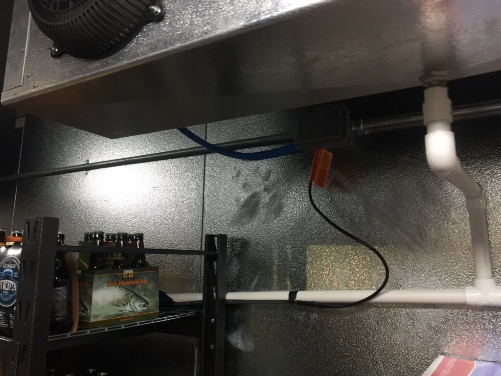 Electrical conduit and wiring installed in a commercial cooler or storage area, demonstrating commercial electrical services by GOBE LLC in Columbia, MO.