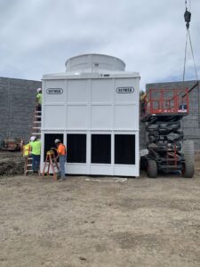 CM3, Inc. technicians installing a large commercial cooling tower at a job site in Wichita, KS.