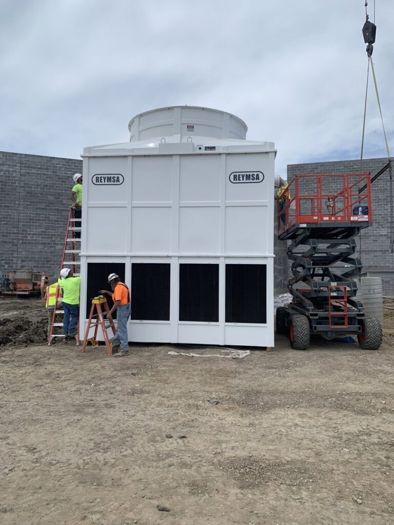 CM3, Inc. technicians installing a large commercial cooling tower at a job site in Wichita, KS.