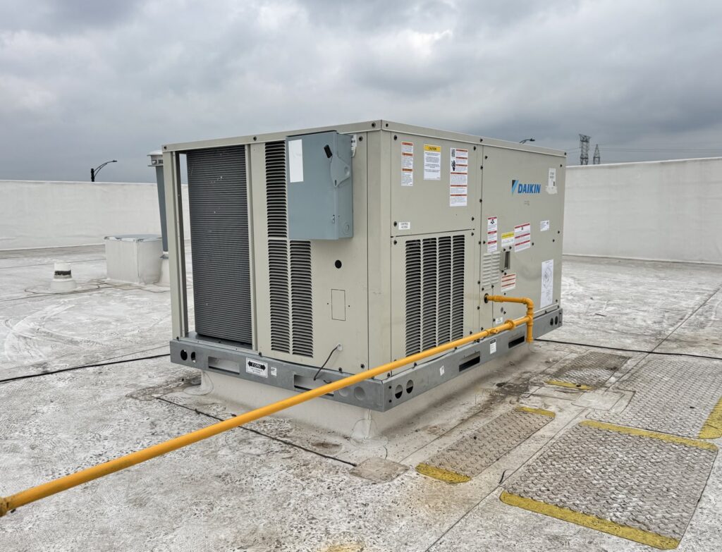 A large commercial Daikin rooftop HVAC unit installed by Empire Tech, Inc. in Schaumburg, IL.