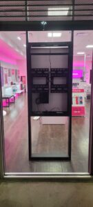 Exposed wiring and TV mounts within a commercial display frame, installed by KS Retail Solutions in Victoria, TX