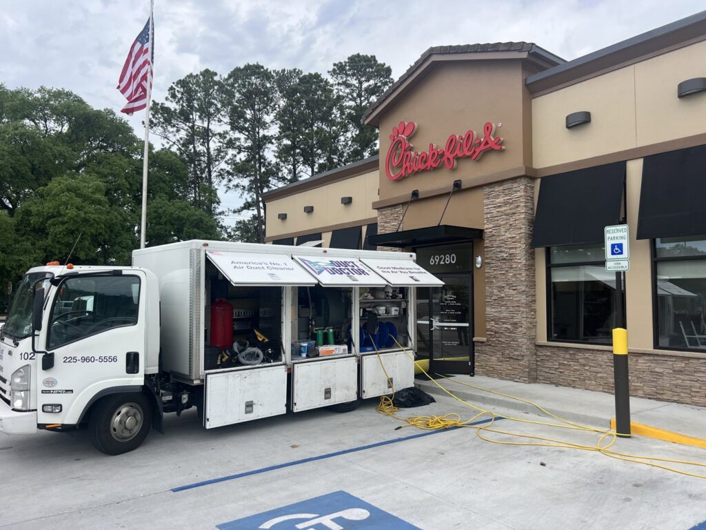 Duct Doctor of Baton Rouge, LA service truck performing commercial air duct cleaning at a Chick-fil-A restaurant.