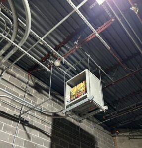 A commercial electrical box and conduit installation suspended from a ceiling by Electric Today in Indianapolis, IN.
